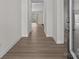 Inviting hallway with sleek flooring, fresh paint, and open sightlines to the living spaces at 127 Tradesmen Trl, Troutman, NC 28166