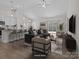 Bright, open-concept living room boasts modern furnishings and a seamless flow to the outdoor patio at 127 Tradesmen Trl, Troutman, NC 28166