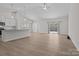 Open-concept living room with modern finishes, a vaulted ceiling, and ample natural light at 127 Tradesmen Trl, Troutman, NC 28166