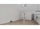 Open concept living room with ceiling fan and hardwood floors at 127 Tradesmen Trl, Troutman, NC 28166
