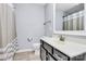 A full bath features a vanity sink, toilet, and shower with neutral-toned shower curtain at 14125 Derby Farm Ln, Charlotte, NC 28278