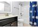 This bathroom features a vanity sink, toilet, and bathtub with showerhead at 14125 Derby Farm Ln, Charlotte, NC 28278
