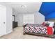 This bedroom features a sloped blue ceiling and an area rug at 14125 Derby Farm Ln, Charlotte, NC 28278