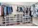 Spacious walk-in closet with organized clothing racks and shoe storage at 14125 Derby Farm Ln, Charlotte, NC 28278