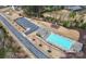 An aerial view of a well-maintained community pool, with ample parking, a playground and recreation area at 14125 Derby Farm Ln, Charlotte, NC 28278