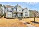 Charming two-story home boasts manicured lawn, stone accents, and a welcoming front porch at 14125 Derby Farm Ln, Charlotte, NC 28278
