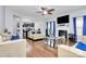 Open-concept living room with hardwood floors, fireplace, and seamless flow to kitchen at 14125 Derby Farm Ln, Charlotte, NC 28278