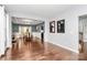 Open-concept living space with hardwood floors, seamlessly connects the living room to the dining area at 14125 Derby Farm Ln, Charlotte, NC 28278