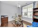 Dedicated office space with hardwood floors, modern desk, and bright natural light at 14125 Derby Farm Ln, Charlotte, NC 28278