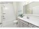 Clean bathroom design with tub, shower, single vanity and gray cabinets at 1614 Shoals Ave # 151, Belmont, NC 28012