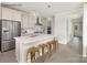 Bright kitchen featuring white cabinets, stainless steel appliances and an island with barstool seating at 1614 Shoals Ave # 151, Belmont, NC 28012