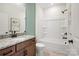 Bathroom with granite counters, wood cabinets, and a modern shower/tub combination at 1615 Shoals Ave # 158, Belmont, NC 28012