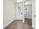 Bright entryway with wood-look floors and a front door featuring glass panes, creating an inviting entrance at 1615 Shoals Ave # 158, Belmont, NC 28012