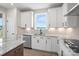 Stylish kitchen with white cabinetry, granite countertops, and modern fixtures at 1615 Shoals Ave # 158, Belmont, NC 28012