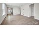 Open living room space with light hardwood floors and a bright, airy feel at 1615 Shoals Ave # 158, Belmont, NC 28012