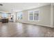 Spacious living room featuring hardwood floors, white walls, and lots of light at 1615 Shoals Ave # 158, Belmont, NC 28012