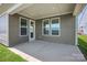Covered patio with three windows and glass paneled doors, providing an ideal indoor/outdoor living space at 1615 Shoals Ave # 158, Belmont, NC 28012