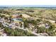 Beautiful aerial view of a home in Verdict Ridge Golf and Country Club surrounded by green trees and a pond at 1742 Verdict Ridge Dr, Denver, NC 28037