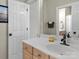 Clean bathroom with a spacious sink, neutral colors, and a large mirror at 1742 Verdict Ridge Dr, Denver, NC 28037
