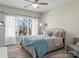 Serene bedroom featuring a decorative window, soft colors, and neutral accents at 1742 Verdict Ridge Dr, Denver, NC 28037