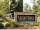 Elegant stone community sign for Verdict Ridge Golf and Country Club with lush landscaping and a water feature at 1742 Verdict Ridge Dr, Denver, NC 28037