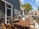 Spacious outdoor deck with a dining table and chairs, perfect for alfresco dining and entertaining at 1742 Verdict Ridge Dr, Denver, NC 28037