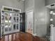 Bright foyer with hardwood floors, grand front door, and a view into the home's open layout at 1742 Verdict Ridge Dr, Denver, NC 28037