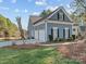 Charming home featuring a three-car garage, well-manicured lawn, and inviting curb appeal at 1742 Verdict Ridge Dr, Denver, NC 28037
