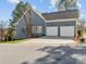Side view of the home with a spacious three-car garage and well-maintained landscaping at 1742 Verdict Ridge Dr, Denver, NC 28037