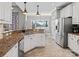 Spacious eat-in kitchen with stainless steel appliances, granite countertops, and tile flooring at 1742 Verdict Ridge Dr, Denver, NC 28037
