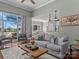 Spacious living room features a view to the outside balcony and into the open kitchen space at 1742 Verdict Ridge Dr, Denver, NC 28037