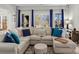 Bright and airy living room featuring a large sectional couch and cozy decor at 1742 Verdict Ridge Dr, Denver, NC 28037