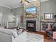 Inviting living room showcasing a stone fireplace, hardwood floors, and modern decor at 1742 Verdict Ridge Dr, Denver, NC 28037