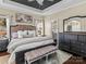 Comfortable main bedroom suite with large bed, dark wood furnishings, and ensuite bathroom at 1742 Verdict Ridge Dr, Denver, NC 28037