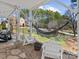 Cozy backyard patio featuring a hammock and Adirondack chairs, ideal for outdoor relaxation at 1742 Verdict Ridge Dr, Denver, NC 28037