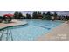 Resort-style pool with slide, seating, and umbrellas at this community's sparkling swimming pool at 1742 Verdict Ridge Dr, Denver, NC 28037