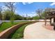 Large, private backyard featuring an expansive patio, a well-manicured lawn and mature trees at 1754 Sterling Rd, Charlotte, NC 28209