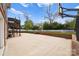 Large backyard featuring a basketball hoop, patio area and a tall privacy fence at 1754 Sterling Rd, Charlotte, NC 28209