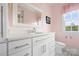 Contemporary bathroom features an elegant vanity and sink and an oversized mirror at 1754 Sterling Rd, Charlotte, NC 28209