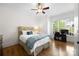 Bright bedroom with hardwood floors, ceiling fan, and natural light from the window at 1754 Sterling Rd, Charlotte, NC 28209