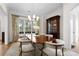 Bright dining room featuring a large window and a classic china cabinet at 1754 Sterling Rd, Charlotte, NC 28209