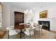 Charming dining room featuring a fireplace, elegant chandelier, and stylish decor at 1754 Sterling Rd, Charlotte, NC 28209
