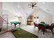 Spacious game room with pool table, game table, wet bar, and a vaulted ceiling with fan at 1754 Sterling Rd, Charlotte, NC 28209