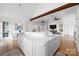 Spacious kitchen island featuring a sink with hardwood floors and views of the dining and living areas at 1754 Sterling Rd, Charlotte, NC 28209