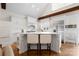 Bright kitchen island with barstool seating, modern stainless appliances and hardwood flooring at 1754 Sterling Rd, Charlotte, NC 28209
