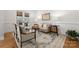 Cozy living room with hardwood floors, a neutral-colored sofa, and French doors leading to the outside at 1754 Sterling Rd, Charlotte, NC 28209