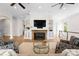 Open-concept living room with fireplace, built-in shelves and staircase access at 1754 Sterling Rd, Charlotte, NC 28209