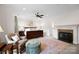 Spacious main bedroom boasts a ceiling fan, fireplace, and large rug at 1754 Sterling Rd, Charlotte, NC 28209
