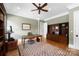 Home office with hardwood floors, a ceiling fan, and a built-in bookcase, perfect for remote work at 1754 Sterling Rd, Charlotte, NC 28209