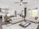 Open-concept living room boasts comfortable seating, natural light, and seamless access to the kitchen at 1914 Sparkling Stream Dr # 057, Belmont, NC 28012